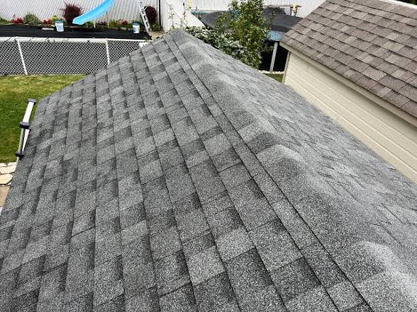 Asphalt shingle roof and ridge detail