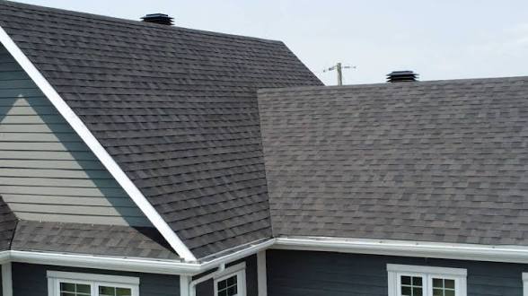 Architectural asphalt shingles across intersecting roof slopes