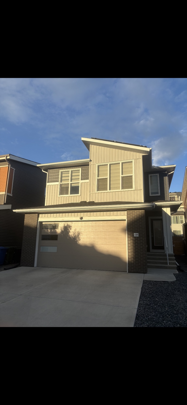 Contemporary home with mixed siding profiles