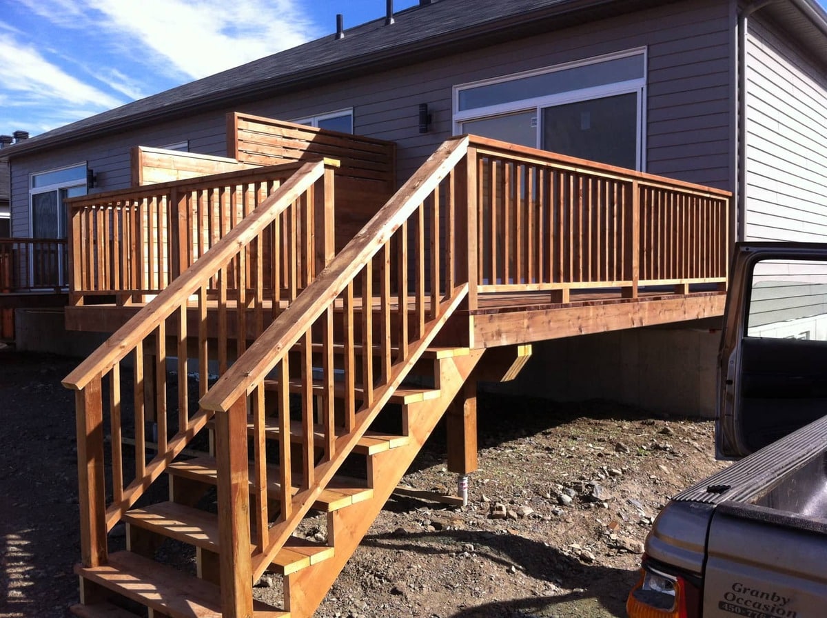 New wood deck with matching stairway and privacy screen