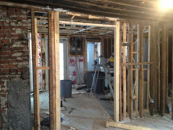 Interior strip-out exposing brick and timber structure