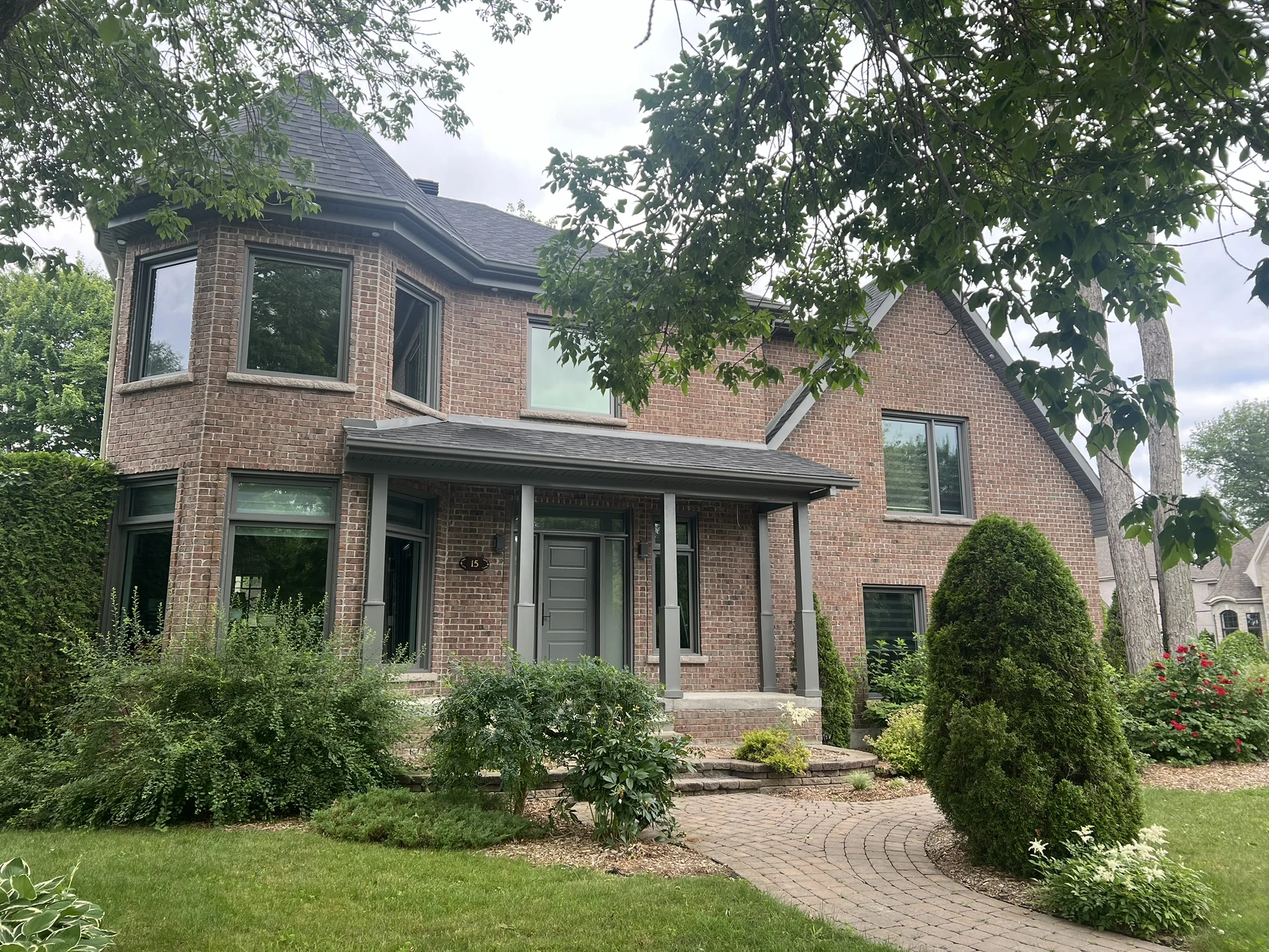 Grey front door with sidelights and matching windows
