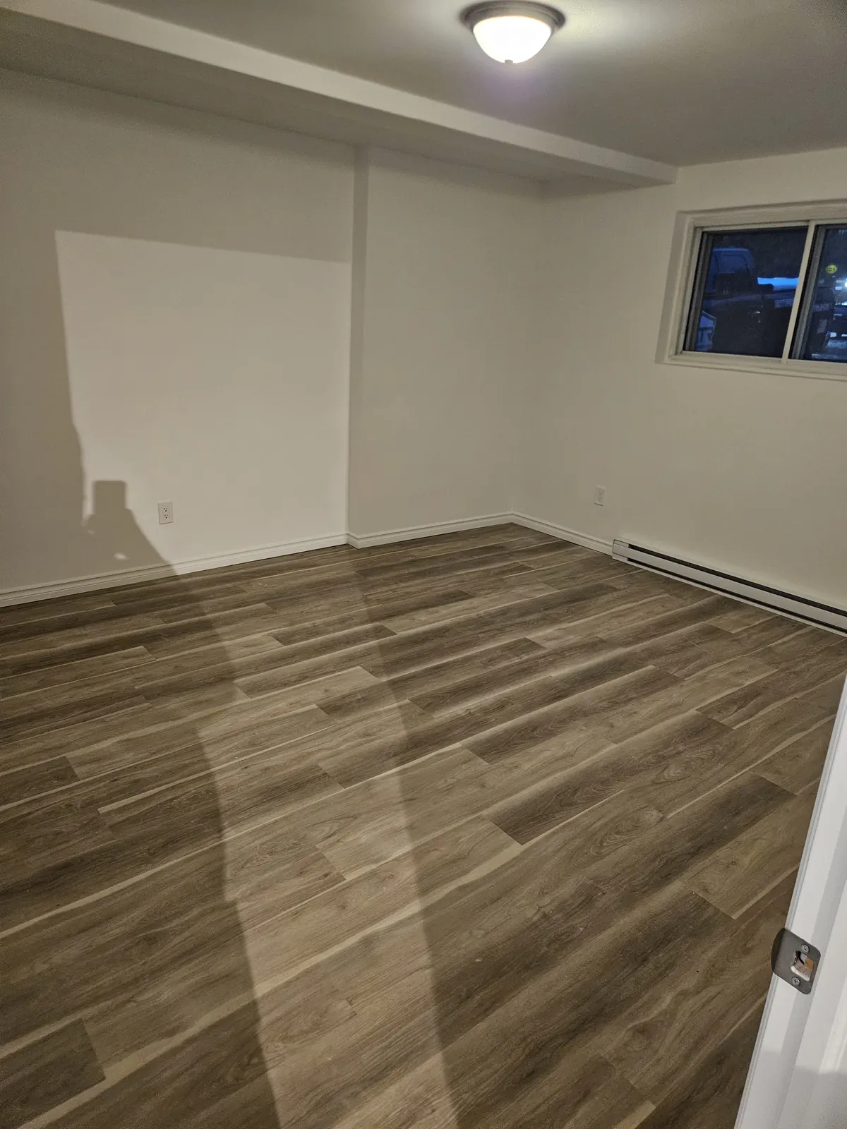 Completed vinyl flooring in an empty room