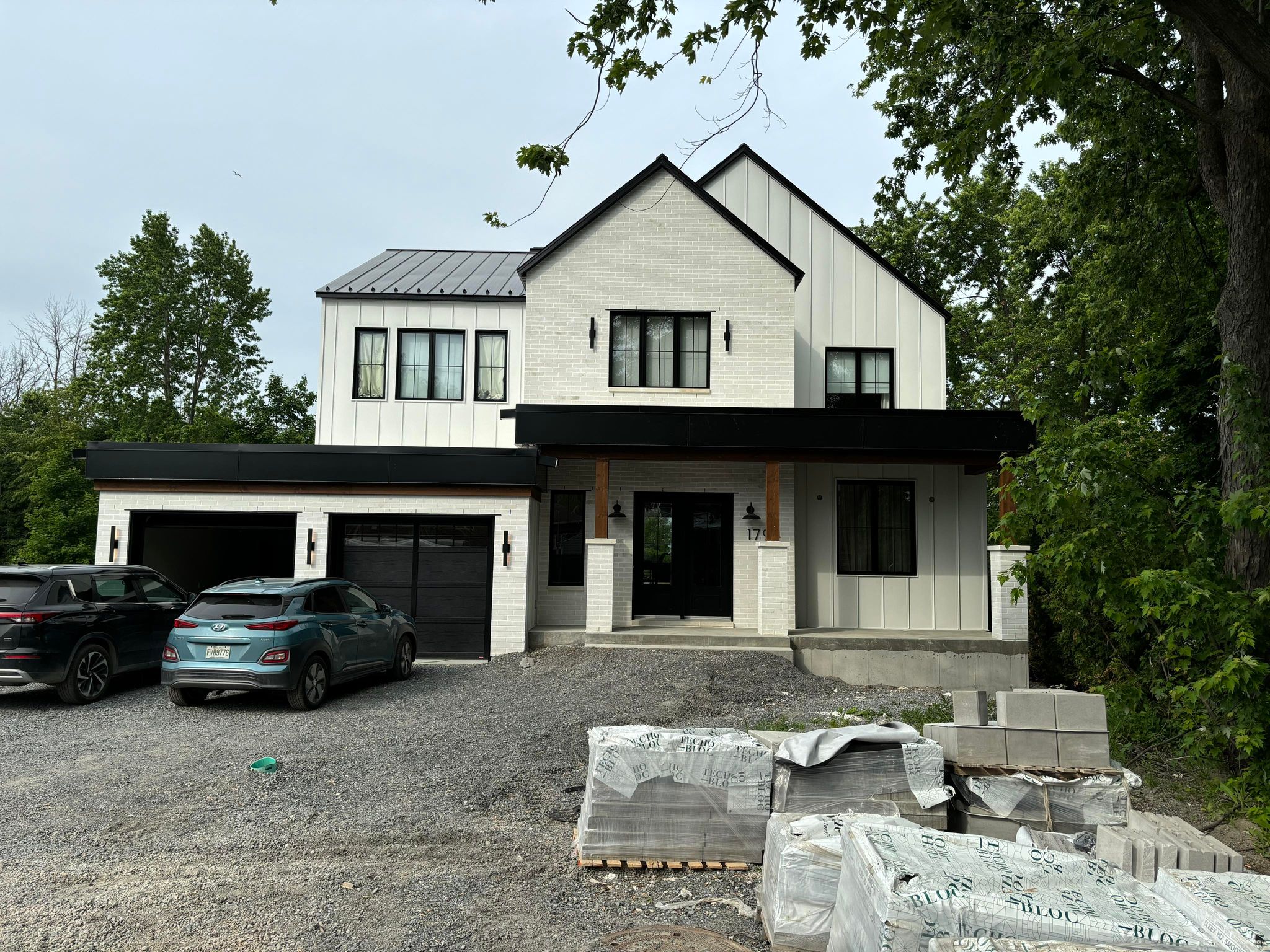 residence with white siding and masonry