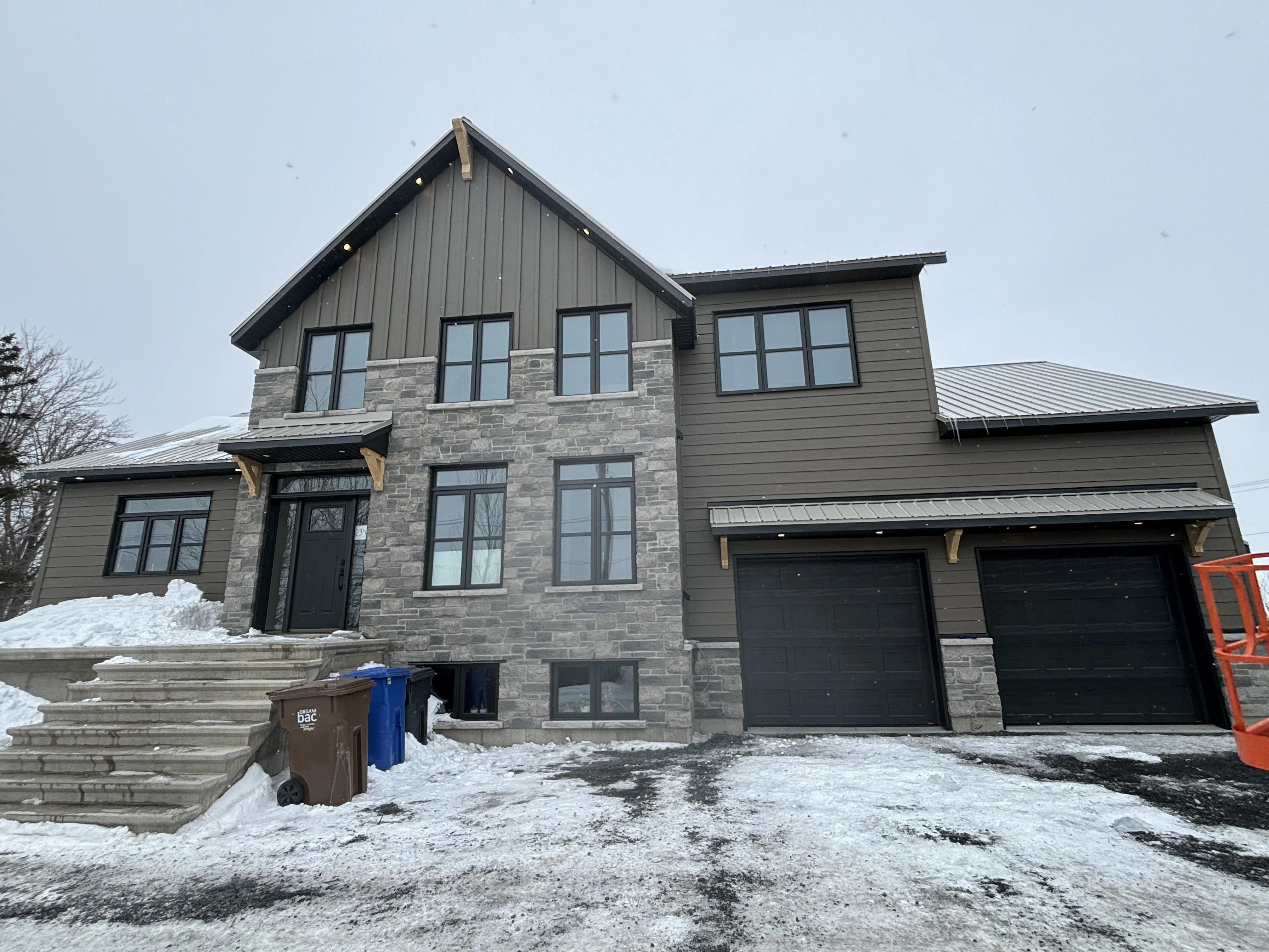 Completed residential exterior with metal roofing