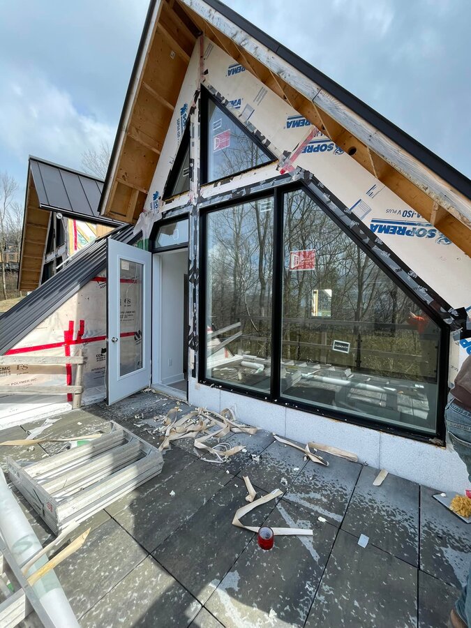 Custom gable glazing installation in progress